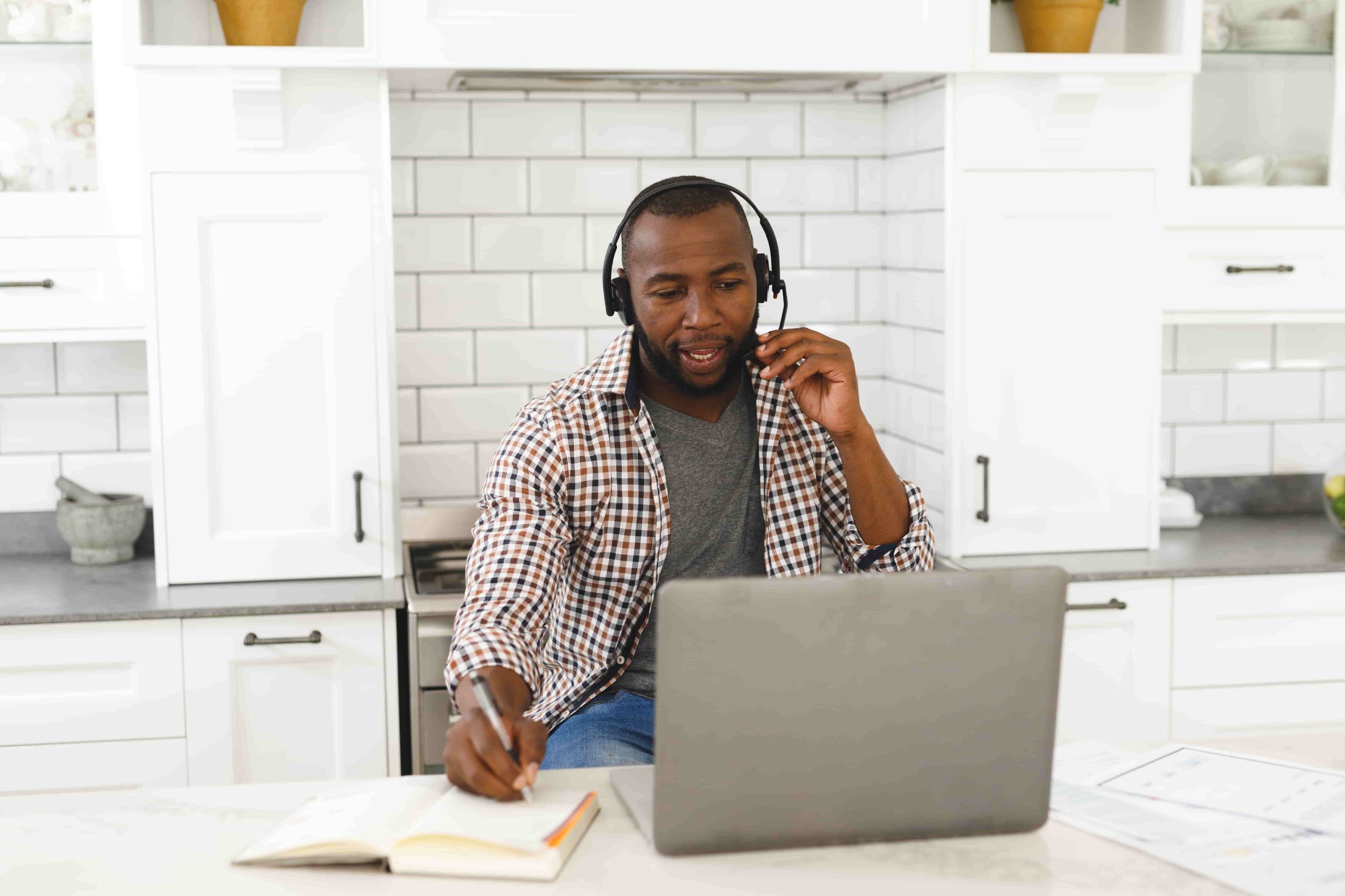 african-american-man-sitting-in-kitchen-making-vid-2021-09-24-22-19-52-utc-min african american man sitting in kitchen making vid 2021 09 24 22 19 52 utc min scaled