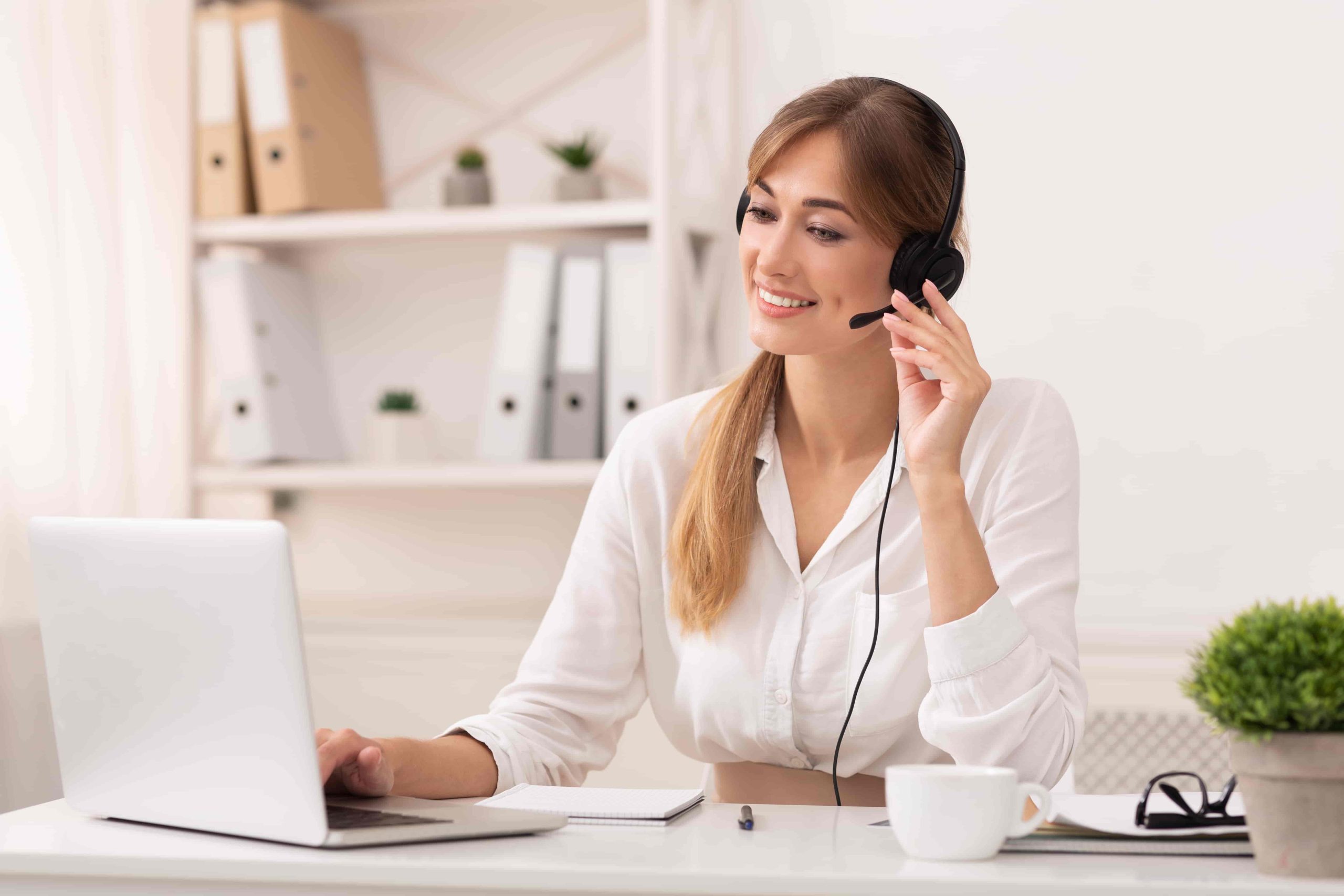 entrepreneur-lady-in-headset-making-video-call-sit-2021-08-26-16-32-54-utc-min entrepreneur lady in headset making video call sit 2021 08 26 16 32 54 utc min scaled
